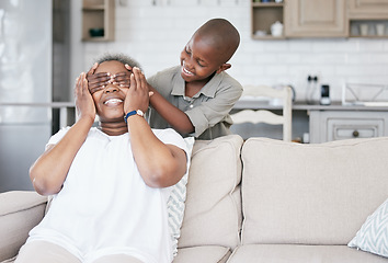 Image showing Family means putting your arms around each other. a boy and his grandma bonding at home.