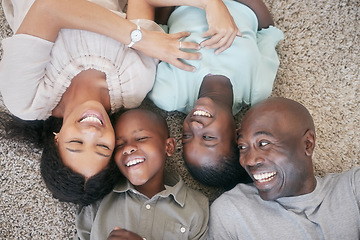 Image showing The love of a family is a lifes greatest blessing. a family laying on the floor at home.