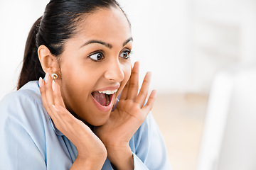 Image showing Good news comes in threes. a young indian businesswoman looking surprised.