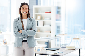 Image showing Ready for the day. a young businesswoman standing in an office at work.