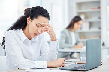Image showing Give your mind a break. a young businesswoman looking overwhelmed in an office at work.