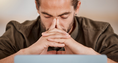 Image showing Running out of ideas. a young businessman suffering from a headache at work.