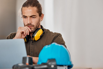 Image showing Hes focused on the vision. a young businessman using a laptop in an office at work.