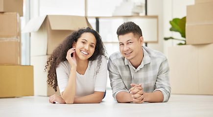 Image showing Therell be plenty more days like this. a young couple taking a break from unpacking in their new homes.