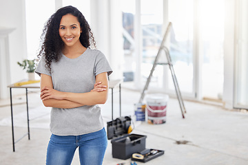 Image showing This room will look a little different in a bit. a woman standing in a room under renovations.