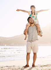 Image showing Dads favourite girl. Full length shot of a handsome young man carrying his daughter on his shoulders at the beach.