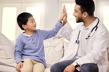 Image showing Dont forget to continue eating all your veggies. a male doctor visiting a little boy at home.