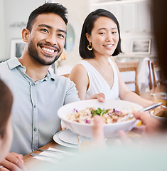 Image showing The only rock I know that stays steady. a young couple have some lunch with the family at home.