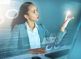 Image showing All the data looks about right. an attractive young businesswoman sitting alone in the office and using a cgi screen.