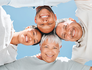 Image showing Family never leave each others side. a family in a huddle outside.