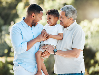 Image showing I want him to experience the same love I received from my father. a little boy posing outside with his father and grandfather.