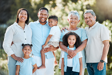 Image showing Togetherness is an important ingredient of family life. a multi-generational family standing together outside.