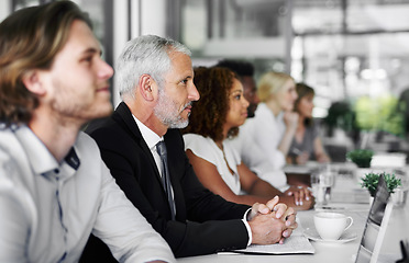 Image showing Intense trust creates incredible teams. a group of businesspeople sitting in a boardroom meeting.