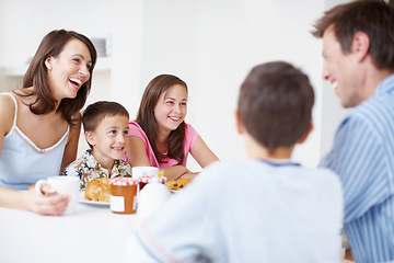 Image showing Bonding at the breakfast table. A loving family enjoying each others company at the breakfast table.