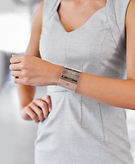 Image showing The future has arrived. Closeup studio shot of a businesswomans arm wearing a smartwatch - All screen content is designed by us and not copyrighted by others.