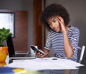 Image showing Doing business from the comfort of home. an attractive young woman working at home.