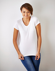 Image showing Shes got spunk. A cropped portrait of a beautiful young woman in jeans and a t shirt.