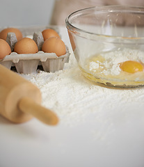 Image showing This is shaping up to be a tasty dish. Closeup shot of a woman making dough in her kitchen.