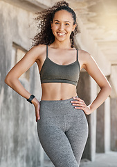 Image showing Work hard pays off. an attractive young woman standing alone in the city during her outdoor workout.