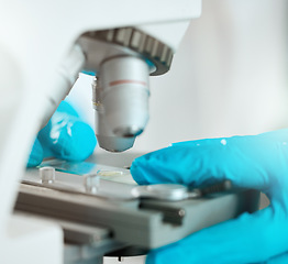 Image showing Time to take a closer look. an unrecognisable scientist using a microscope to analyse a sample in the laboratory.