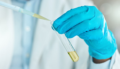 Image showing Im determined to find a cure. an unrecognisable scientist using a test tube and dropper in the laboratory.