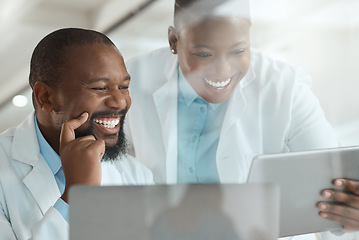 Image showing I wanted to show you this reaction. two scientists using a laptop and digital tablet in a laboratory.