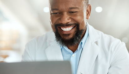 Image showing Ive got a clear overview after running tests. a handsome mature scientist sitting alone in his laboratory and using his laptop.