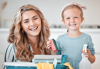 Image showing Little caucasian girl helping her mother with household chores at home. Happy mom and daughter excited to do spring cleaning together. Kid learning to be responsible by doing tasks