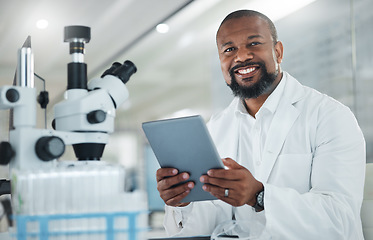 Image showing I just cant make a breakthrough with this case. a male scientist using a digital tablet while working in a lab.