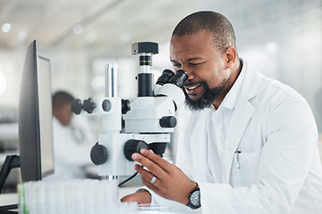 Image showing New samples have come in for the case study at hand. a mature man using a microscope in a lab.
