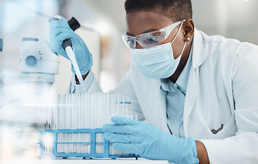 Image showing What a curious discovery. a young scientist working with samples in a lab.