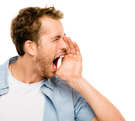 Image showing Letting his emotions fly free. a young man shouting against a studio background.