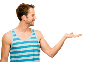 Image showing Space for new possibilities. a young man gesturing against a studio background.