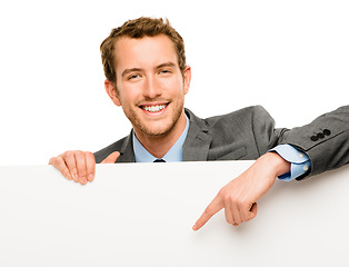 Image showing Holding a space for you. a businessman holding a blank placard against a studio background.