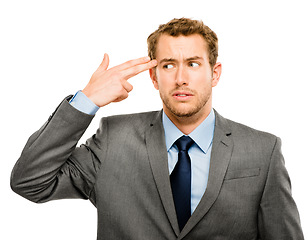 Image showing He needs a break. businessman miming his brains being blown out against a studio background.