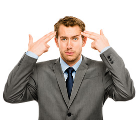 Image showing Business has gotten to him lately. businessman miming his brains being blown out against a studio background.