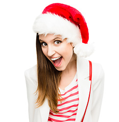 Image showing Lets crank up this Christmas party. a young woman in the christmas spirit against a studio background.