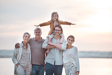 Image showing We love spend time together as a family. a multi-generational family spending the day at the beach.