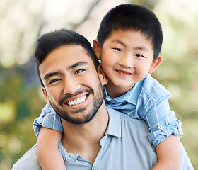 Image showing The kind of dad every child deserves. an adorable little boy and his father having a fun day at the park.