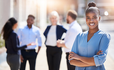 Image showing The best business for your every need. a young businesswoman standing with her arms crossed outside.