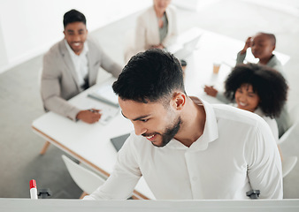 Image showing Getting all the best ideas on paper. a young businessman writing on a whiteboard during a meeting at work.