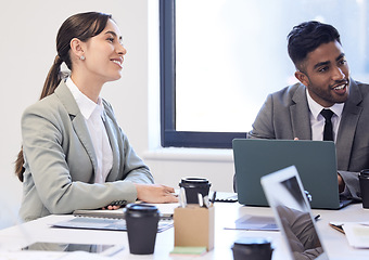 Image showing Motivated and eager for the days plans. two businesspeople having a meeting in a boardroom.