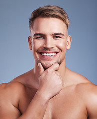 Image showing Ive decided to grow my beard. Closeup shot of a handsome young man smiling while posing against a studio background.