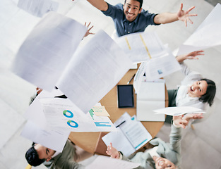 Image showing Time is an equal opportunity employer. Aerial shot of a diverse group of businesspeople throwing paperwork in the air in celebration while in the office.