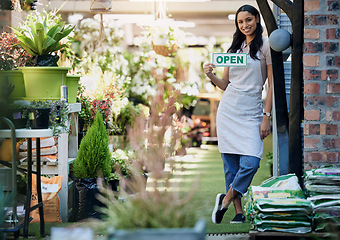 Image showing Brighten up your Monday blues with a quick stop. Portrait of a business owner holding an open sign.