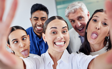 Image showing Take time to unleash your inner child. a group of businesspeople taking a selfie at work.
