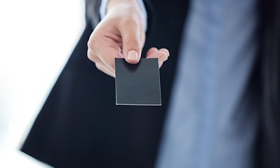 Image showing Credit cards are a safe way to carry money. an unrecognizable businesswoman holding a credit card at work.