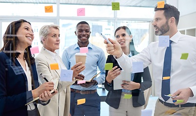 Image showing Working together is a success. a group of businesspeople having a meeting in a boardroom at work.