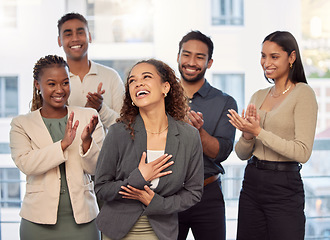 Image showing I feel so special. a group of businesspeople clapping for a colleague at work.