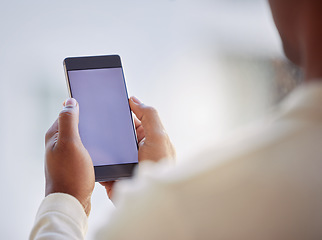 Image showing Its great to be connected wherever I go. an unrecognizable businessperson using a phone at work.